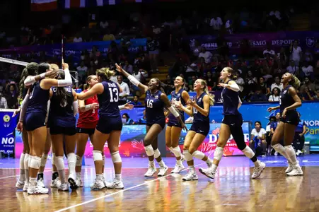 US Volleyball bench celebrates a win over Mexico
