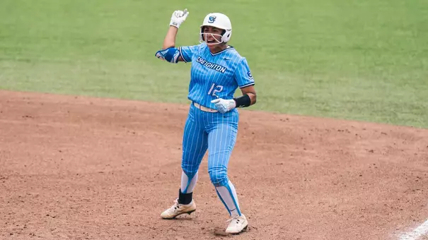 Erika Perez provides an empathic fist pump after driving in the game-winning run at the BIG EAST Tournament.