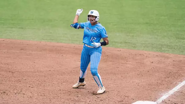 Erika Perez provides an empathic fist pump after driving in the game-winning run at the BIG EAST Tournament.