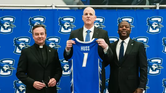Fr. Hendrickson, Alan Huss and Marcus Blossom