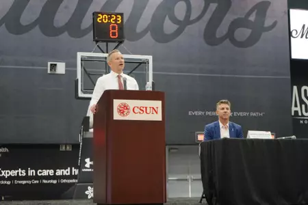 Director of Athletics Shawn Chin-Farrell and Head Basketball Coach Andy Newman