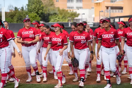 Softball team leaving the field.
