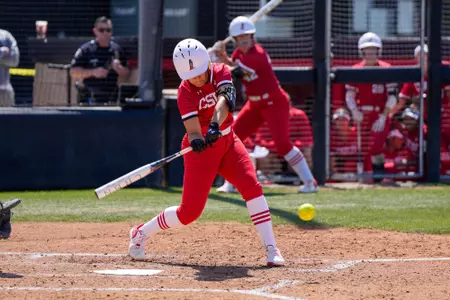 Jerzie Liana trying to hit the ball.