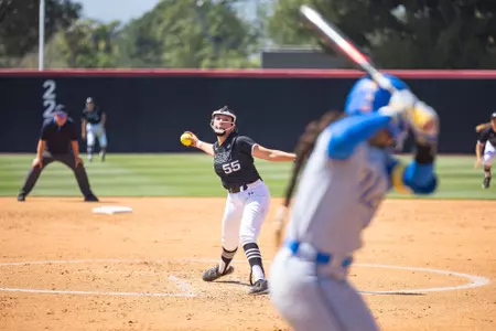 Alexa Ortiz pitching to a UCLA batter.
