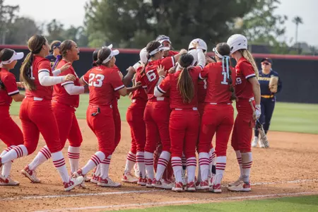 Team cheering together after a win.