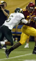 Robert Herbert attempts to tackle Minnesota's Laurence Maroney during the first half of the Rams 56-24 loss. (AP Photo/Paul Battaglia)