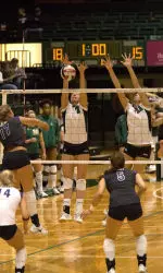 Mokelki and Nelson record a block in the first match this season against TCU.