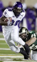 Erik Sandie reaches out to try to trip up TCU's Lonta Hobbs.