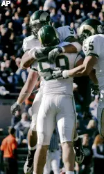 Nading is congratulated after returning an INT for a touchdown at BYU