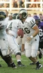 Colorado State quarterback Caleb Hanie (16) looks to pass as TCU linebacker Jason Phillips (39) is stopped by Colorado wide receiver Johnny Walker, center, in the first quarter. (AP Photo/Donna McWilliam)