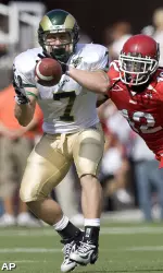 John Mosure hauls in a reception vs. Utah. (AP Photo/Kenny Crookston)
