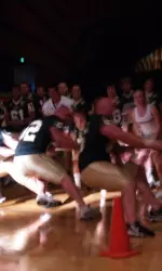 Defensive players battle in the tug of war en route to their narrow victory Friday night