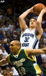 BYU guard Jimmer Fredette (32) takes a shot over Colorado State guard Arin Dunn (40). (AP Photo/Daily Herald, Mario Ruiz)
