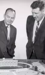 Fum McGraw and Jim Williams look at a model of what was to become Hughes Stadium