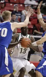 Colorado State's Andre McFarland, center, is defended by Air Force's Grant Parker, left, and Andrew Henke during the second half