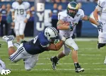 John Mosure tries to avoid a tackle from BYU's Romney Fuga.