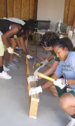 The team puts its hammers to use
