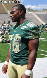 Defensive captain Ricky Brewer does an interview while helping to unveil the Rams' new Russell uniforms.