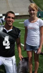 Pete Thomas, pictured with a fan on Meet the Rams day, took most snaps with the first team.