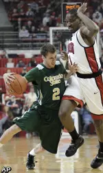 Wes Eikmeier tries to drive around UNLV's Quintrell Thomas.