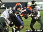 Nordly Capi forces his NCAA-leading sixth fumble as Shaq Bell, who would recover, looks on.