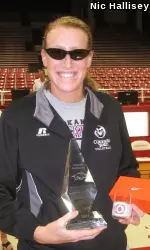 Senior Katelyn Steffan poses with the championship trophy and her MVP sunglasses after winning the Arkansas Invitational.