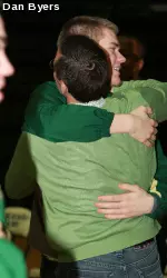 Jesse Carr embraces his head coach, Tim Miles, on Sunday after learning of the Rams' tournament destination.
