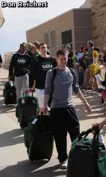 Fans cheer as the Rams board the bus to travel to Louisville, Ky., for the second and third rounds of the NCAA tournament