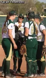 Junior P Kacie McCarthy talks with members of the infield during Friday's game