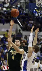 Pierce Hornung shoots as Air Force's Todd Fletcher goes up for a block.