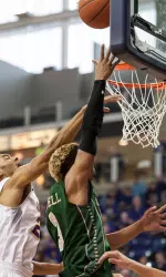 Gian Clavell goes up for a layup at UNI