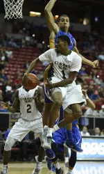 Antwan Scott (1) behind the back to Emmanuel Omogbo for the layup