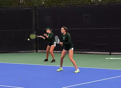 Emily Luetschwager and Stella Cliffe in doubles play