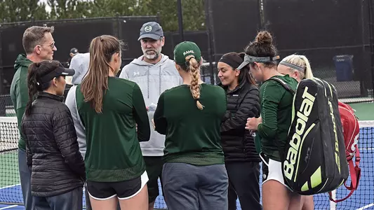 Coach Jarod Camerota meets with the team at the Jon Messick Invitational.