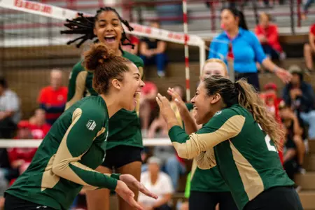 Malaya Jones and Helena Perez celebrate against New Mexico