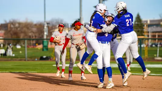 Molly Gates celebrates walk off with teammates