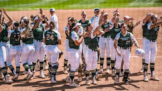 Softball team celebrates after win over Fresno State