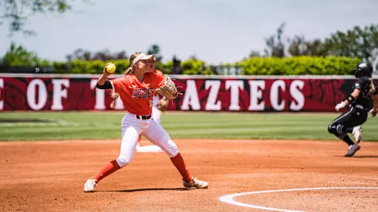 Kaitlyn Cook throws the ball to first