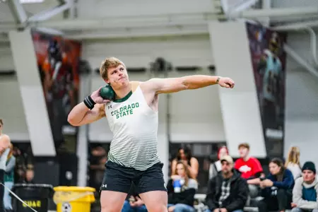 Kyle Bigley competing in shot put