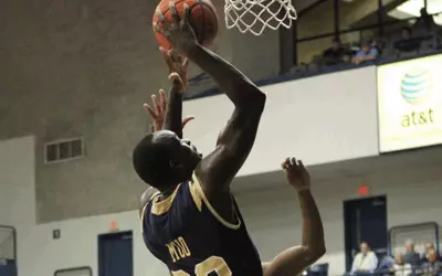 Team Effort, Solid Defense Leads Bucs Past Cross-Town Rival Bulldogs Image