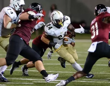 Troy pulls away to hand Bucs first loss, 44-16 Image