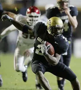 Colorado tailback Brian Calhoun, front,