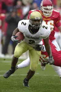 Colorado's Brian Calhoun (2) runs past