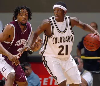Colorado guard Marcus Hall, right, works