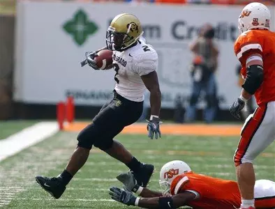 Colorado tailback Hugh Charles, left,