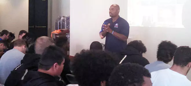 Chris Draft talks to CU football team