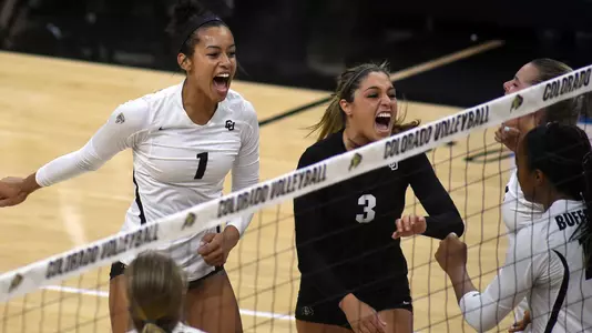 The volleyball team celebrates a point against Stanford