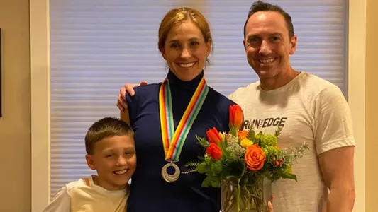 Kara Goucher with her family after receiving her silver medal from the 2007 IAAF World Championship
