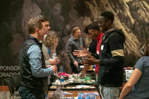 LCDP networking event. Athlete speaking with representative.