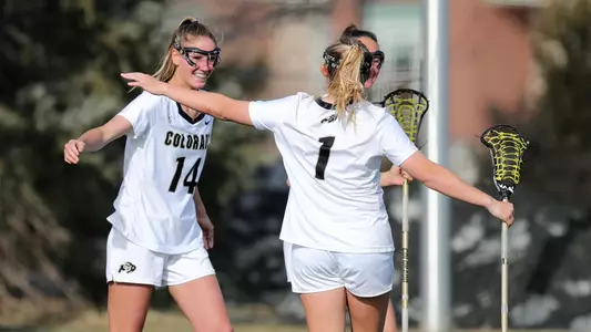 zoe lawless celebrates a goal with charlie rudy